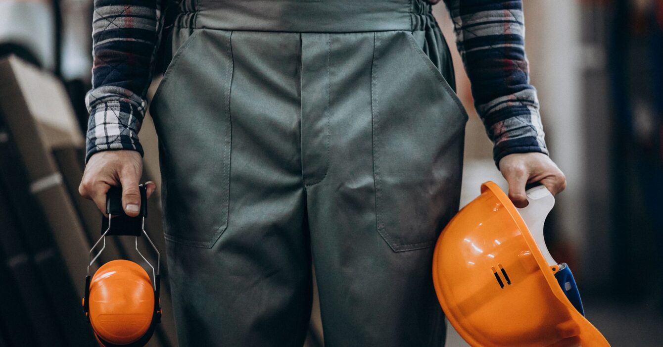 young-male-handyman-with-safety-earphones